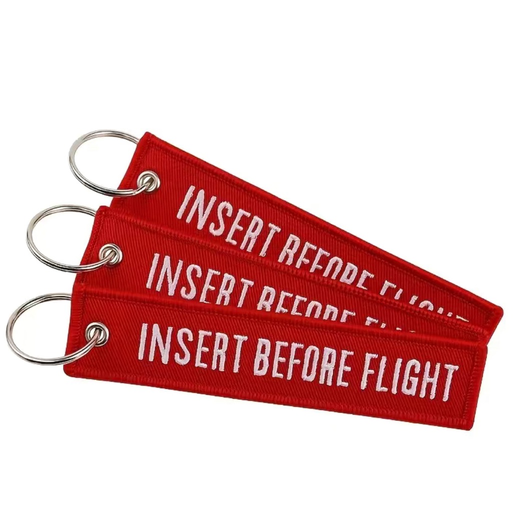 Insert Before Flight Keychain